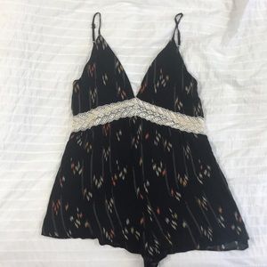 Low cut black printer romper